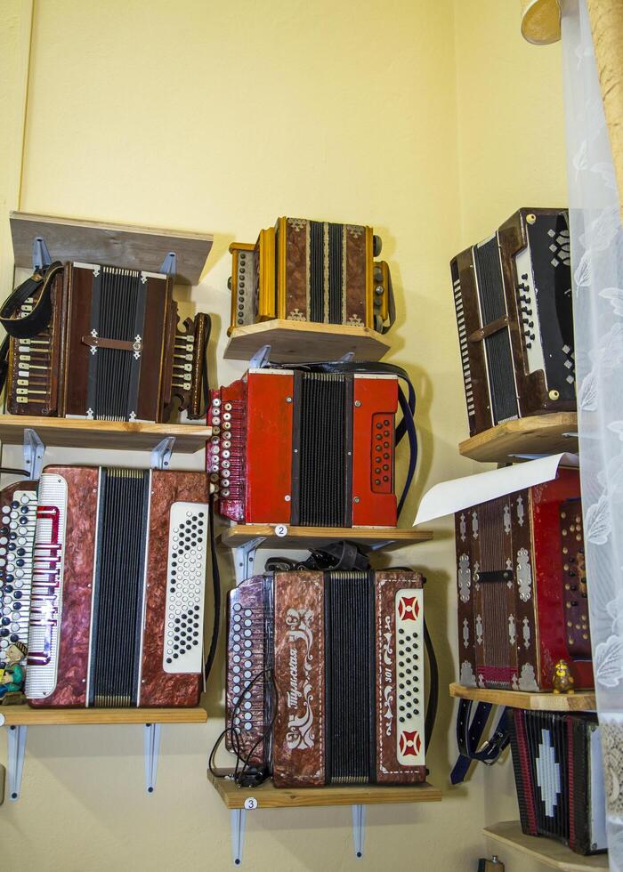 moscow, russia, 18.10.2016 A row of accordions are displayed on shelves photo