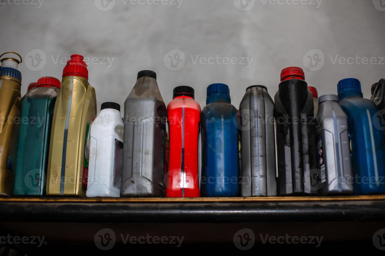 a shelf with many different types of bottles photo