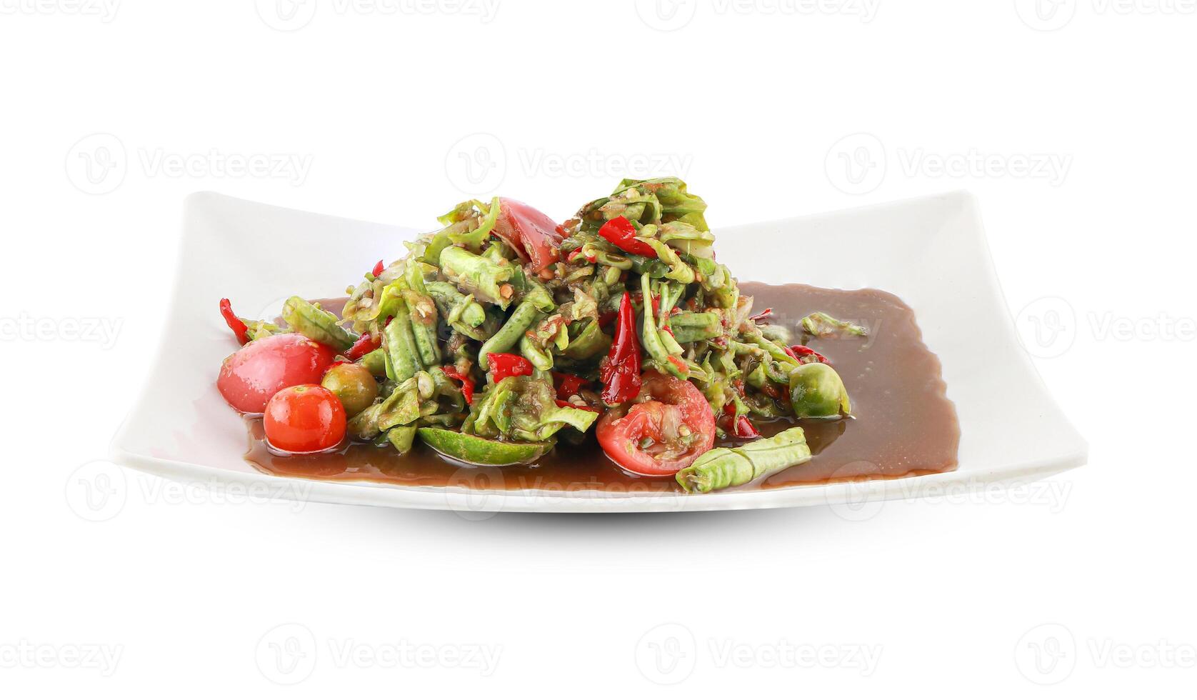 Close-Up of Spicy Long Bean Salad with Fresh Vegetables in a Ceramic Bowl isolated on white background with clipping path. Thai street food. photo