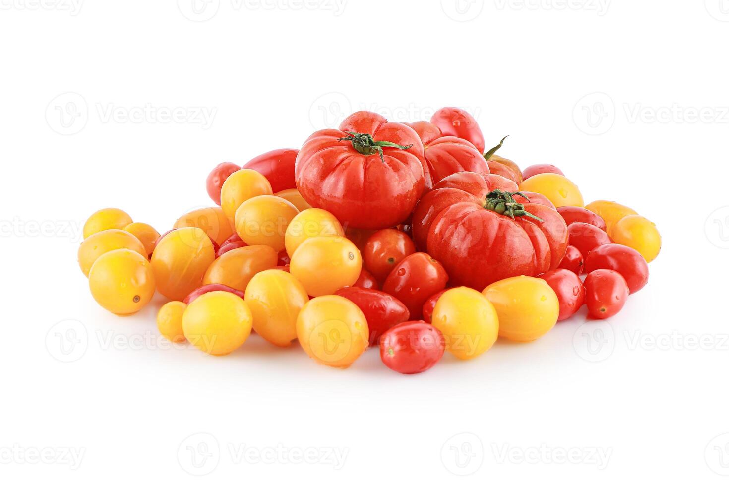 Red and yellow tomato with green leaf isolated on white background with clipping path. photo