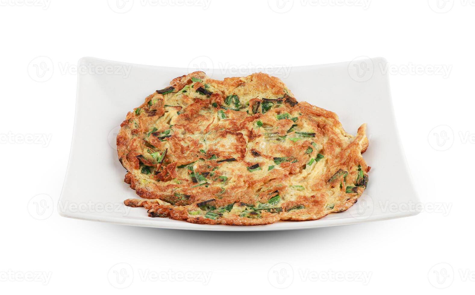 Fry an omelet Served in a white plate isolated on white background with clipping path, Thai Food. photo