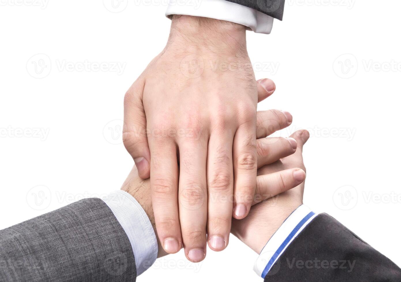 Business team showing unity with hands together photo