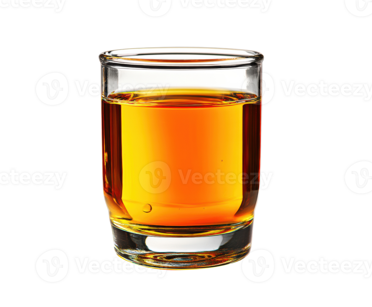 Sip of amber liquid in a clear glass on a neutral surface png