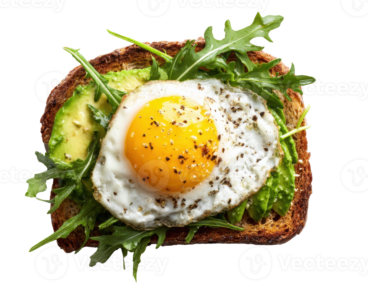 Avocado toast topped with fried egg and arugula for breakfast png