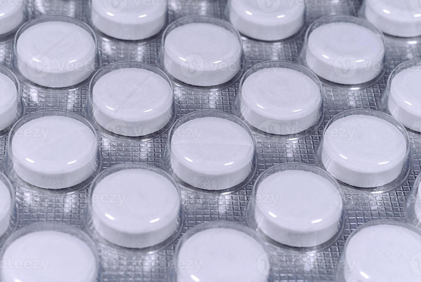 White tablets in silver blister pack photo