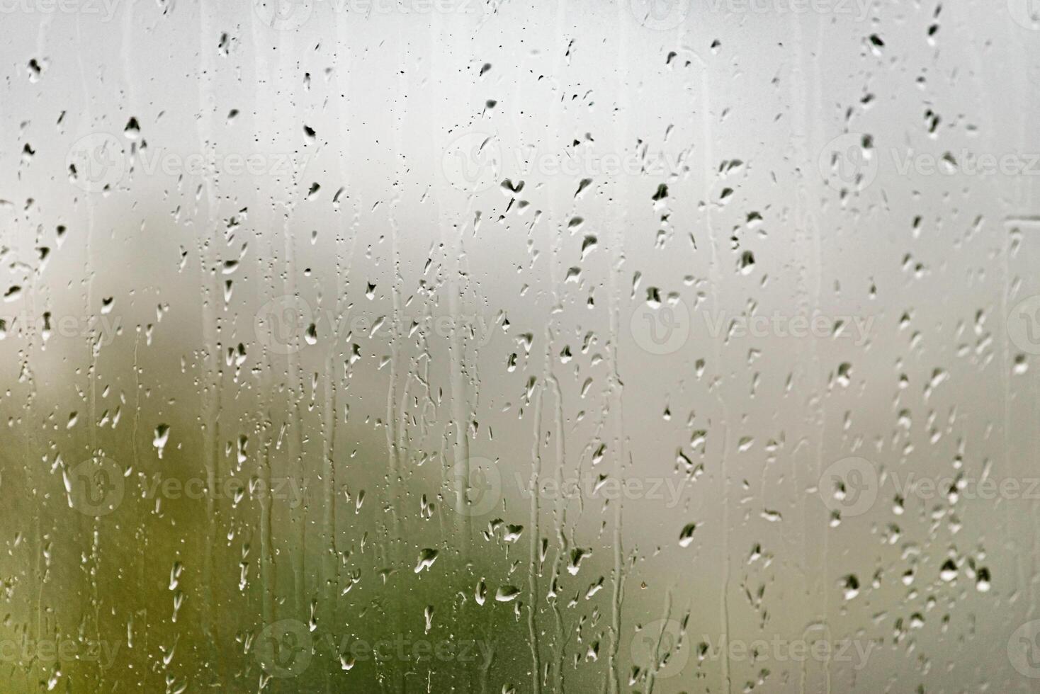 Closeup of Rain Drops on Glass Window photo