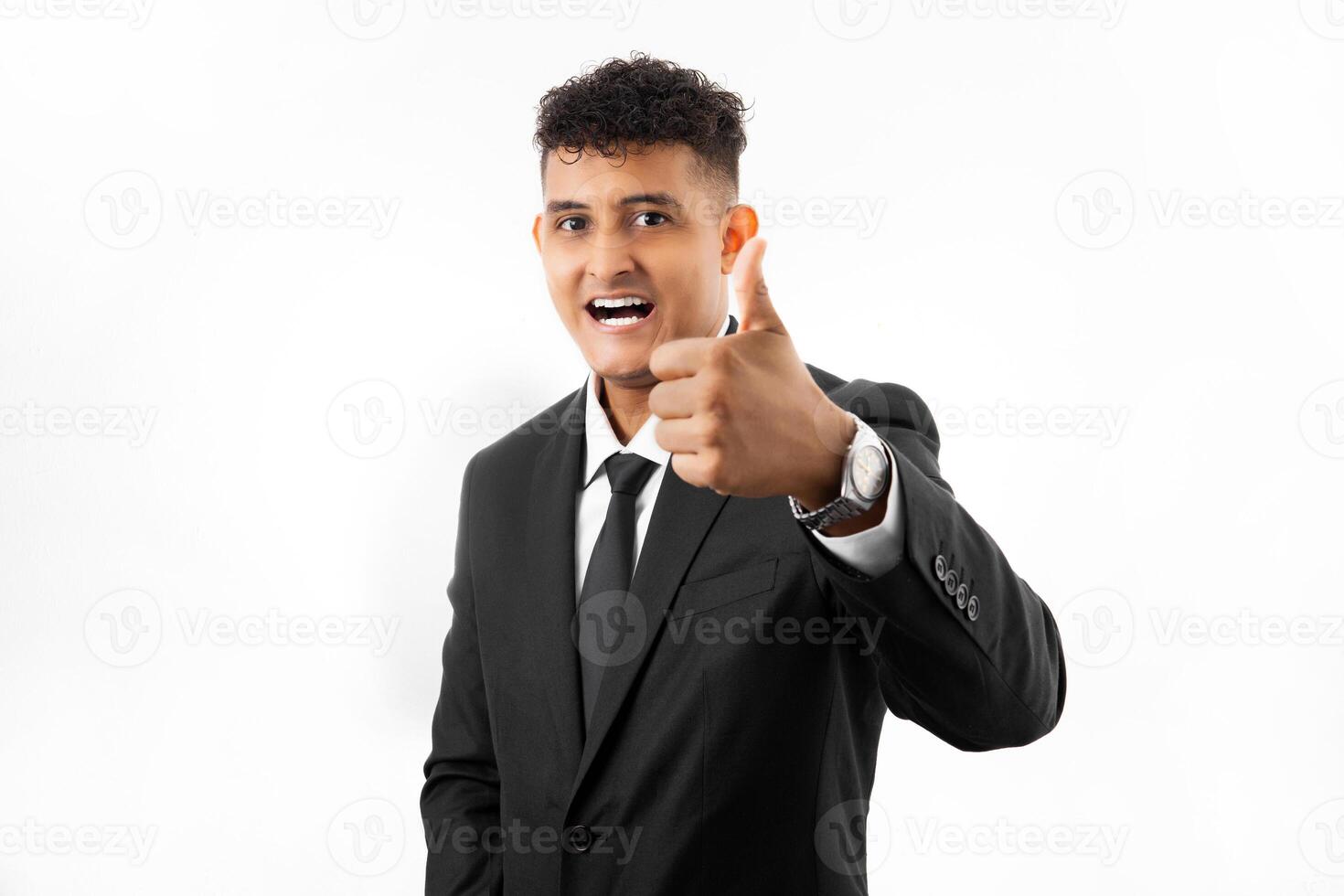 Portrait of a business man over white background very happy and excited doing winner gesture with arms raised. photo