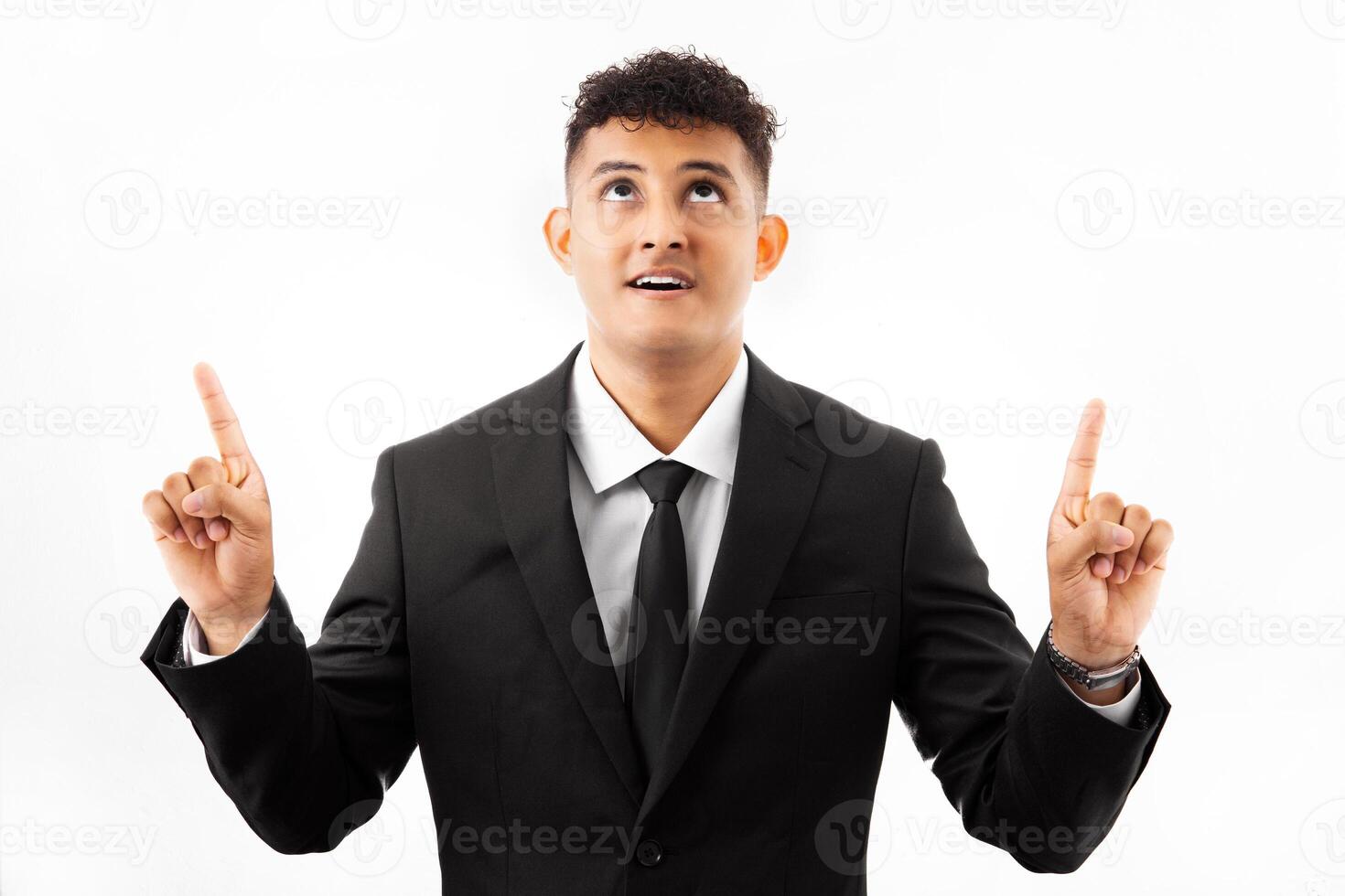 Portrait of a man wearing business suite over white background very happy and excited doing winner gesture with arms raised. photo