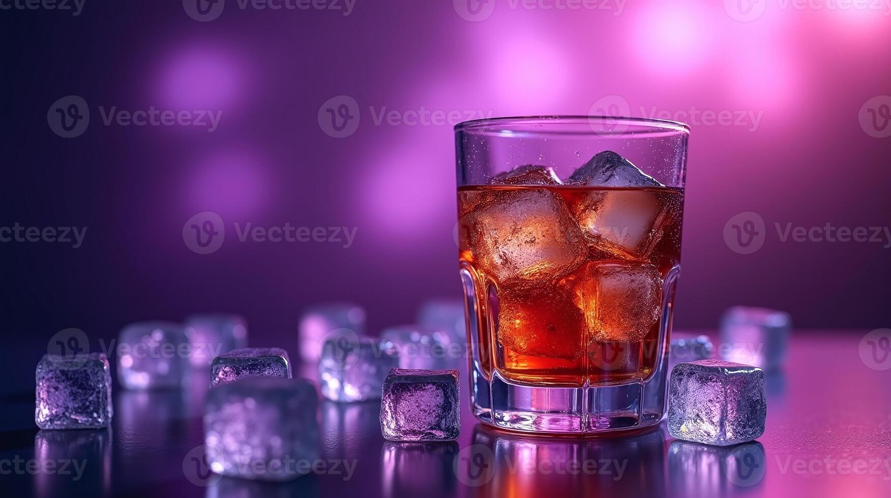 A glass filled with ice and a reddish-brown liquid, surrounded by more ice cubes on a reflective surface. photo