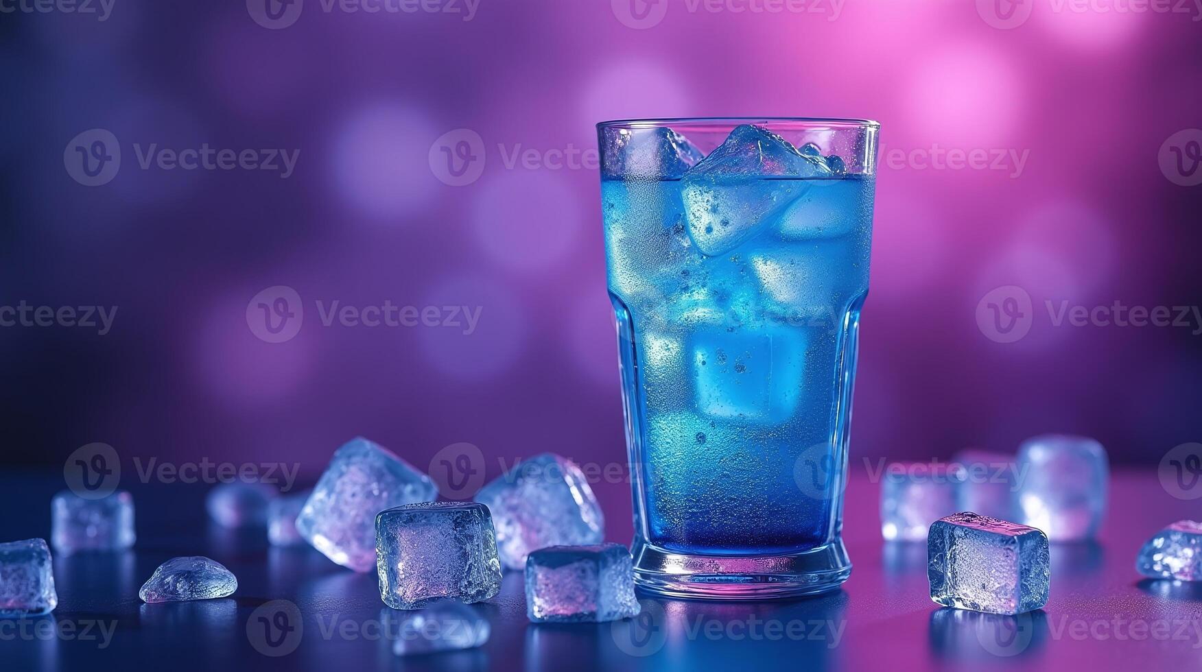 A refreshing blue cocktail with ice cubes in a glass, set against a blurred bokeh background. photo