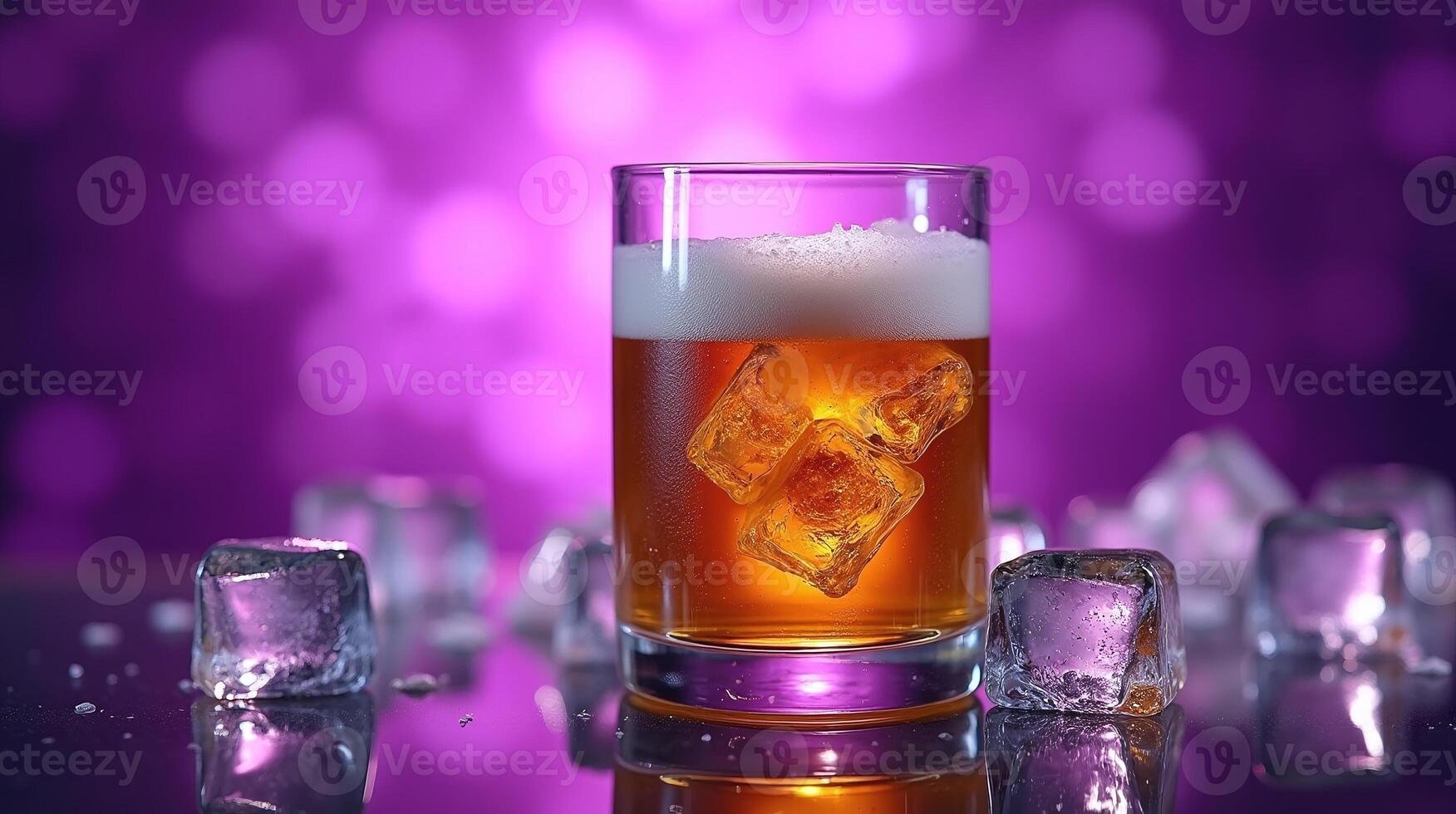 A frothy drink in a glass beaming with ice cubes. photo