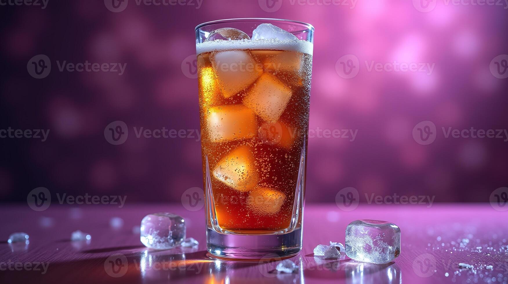 A refreshing beverage in a tall glass adorned with ice cubes against a vibrant, blurred backdrop. photo