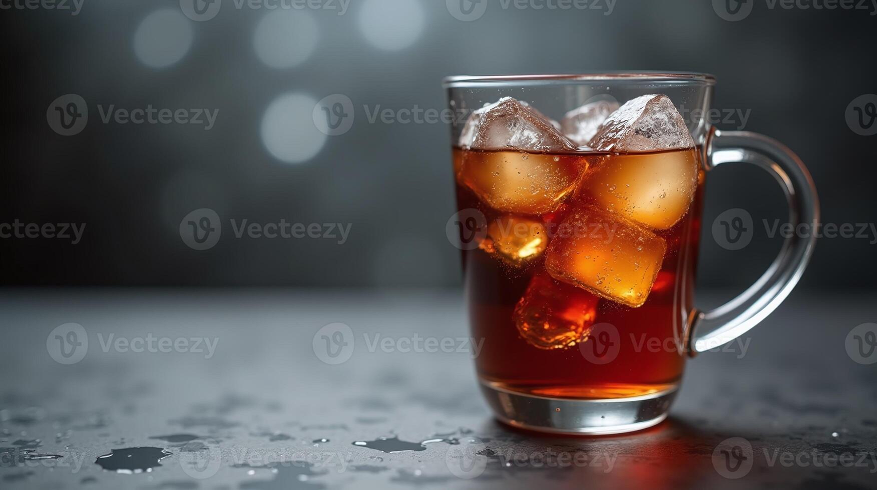 A glass mug with ice cubes and a dark liquid, set against a blurred background. photo