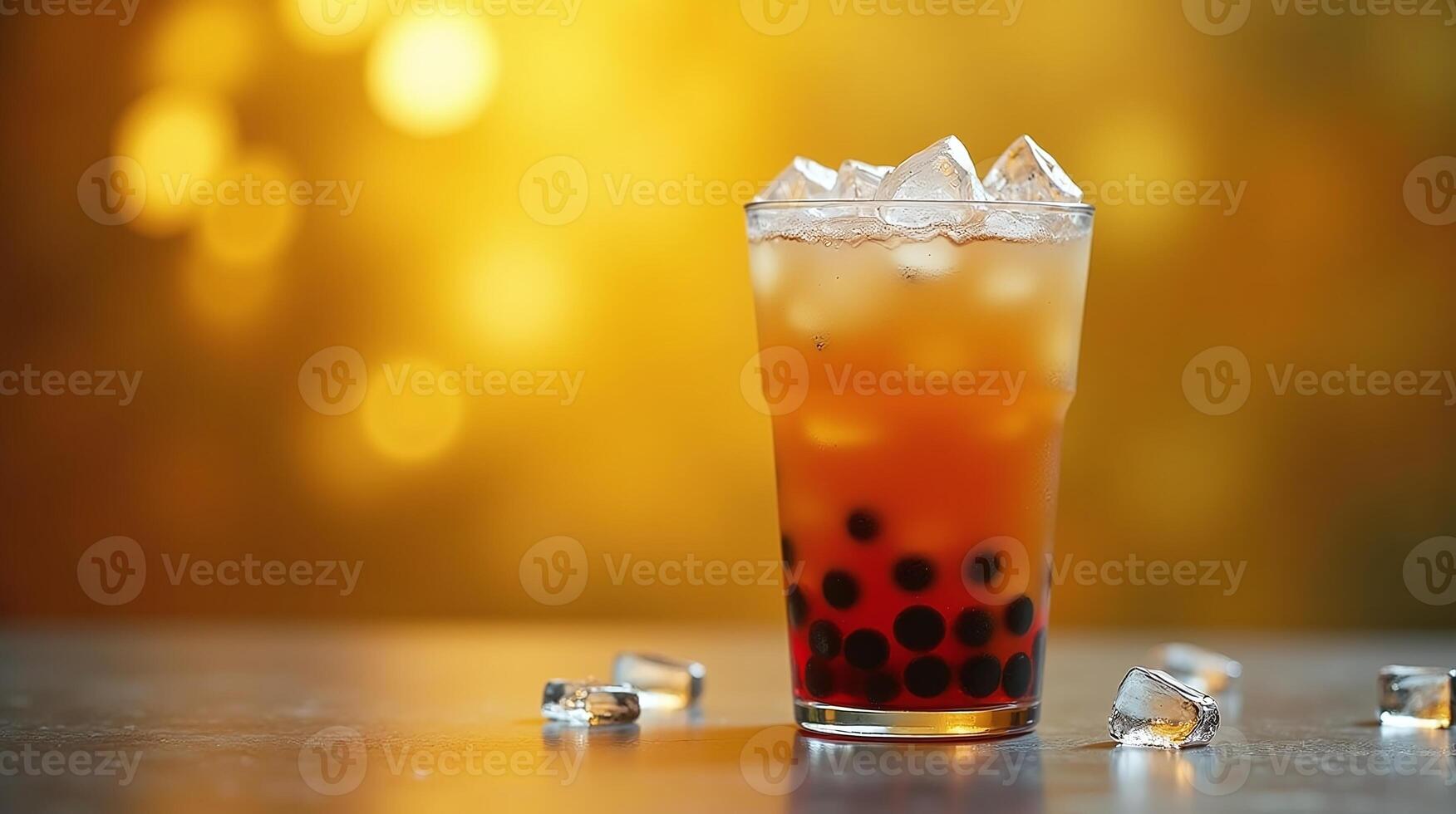 A glass of iced bubble tea on a table. photo