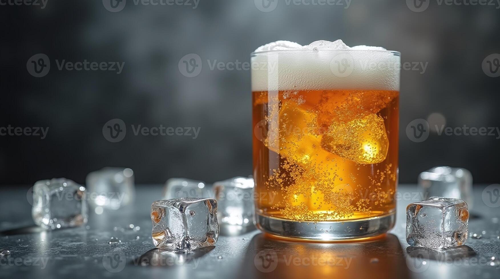 A close-up of a frothy beer glass with ice cubes, set against a blurred background. photo