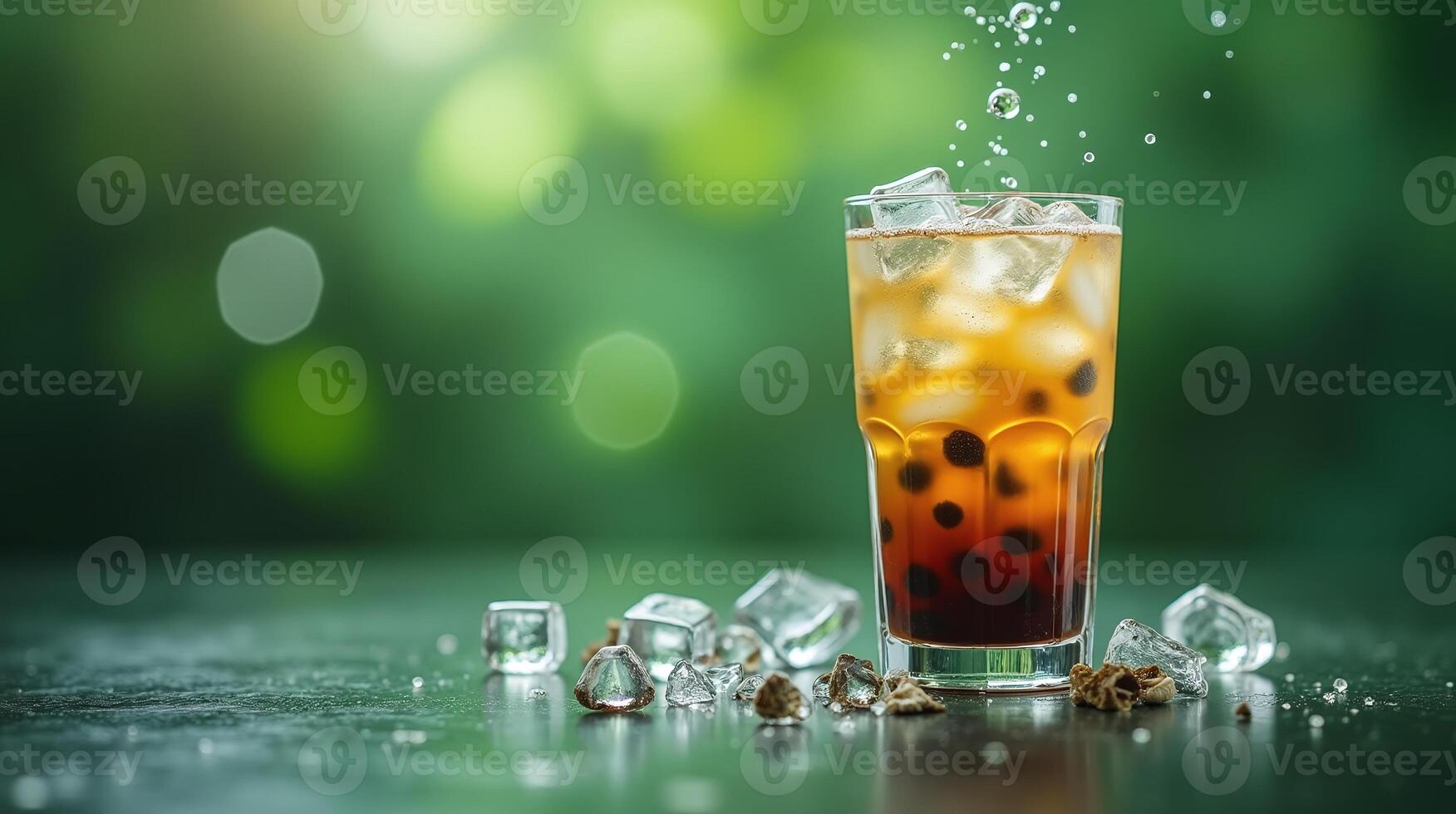 An ice-cold refreshing beverage adorned with floating bubbles and garnished with ice cubes and pearls. photo