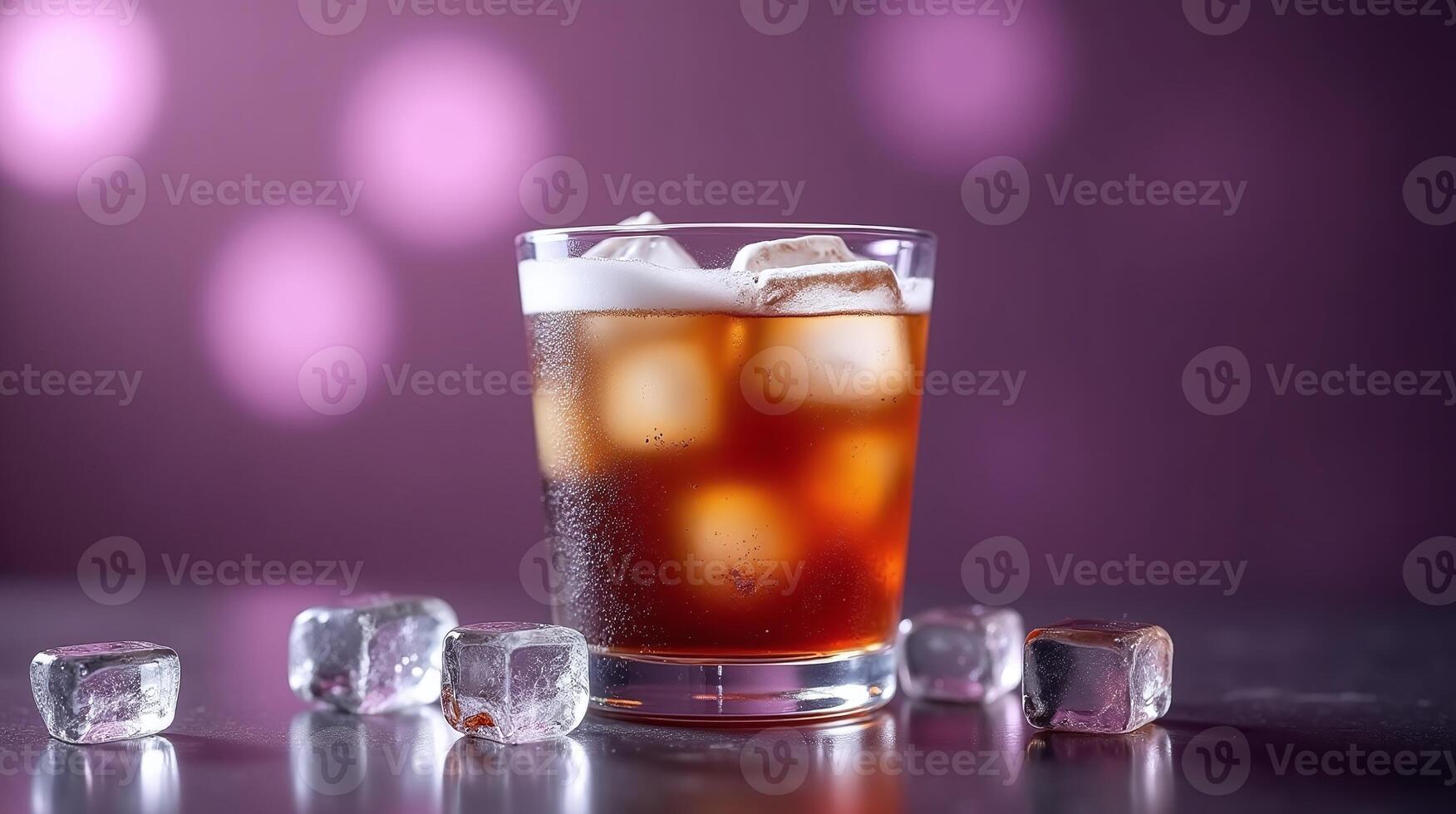 A glass of refreshing carbonated beverage with ice cubes. photo