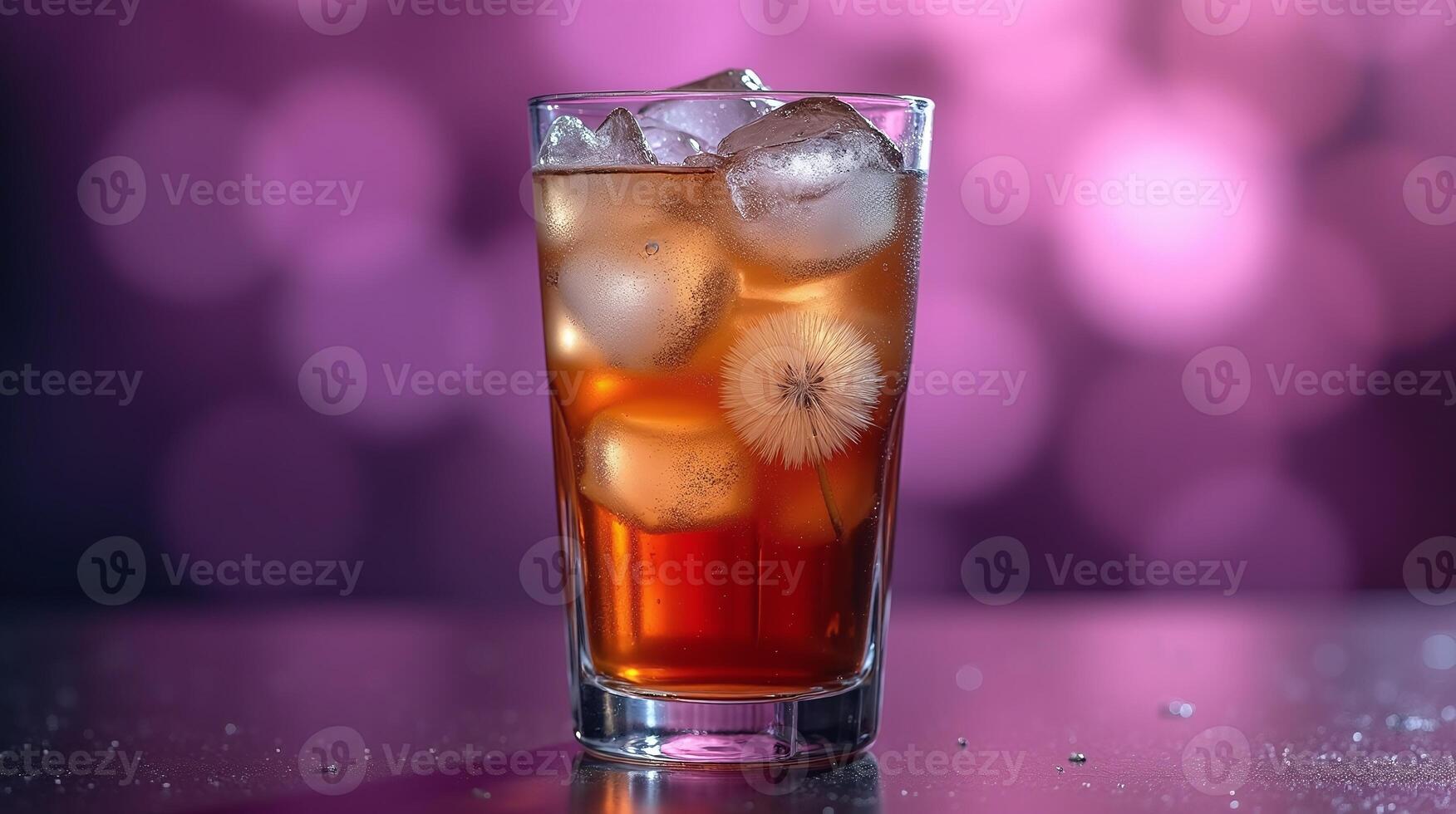 A vibrant beverage in a tall glass, adorned with an intricate dandelion seed head, rests against a blurred, luminescent background. photo