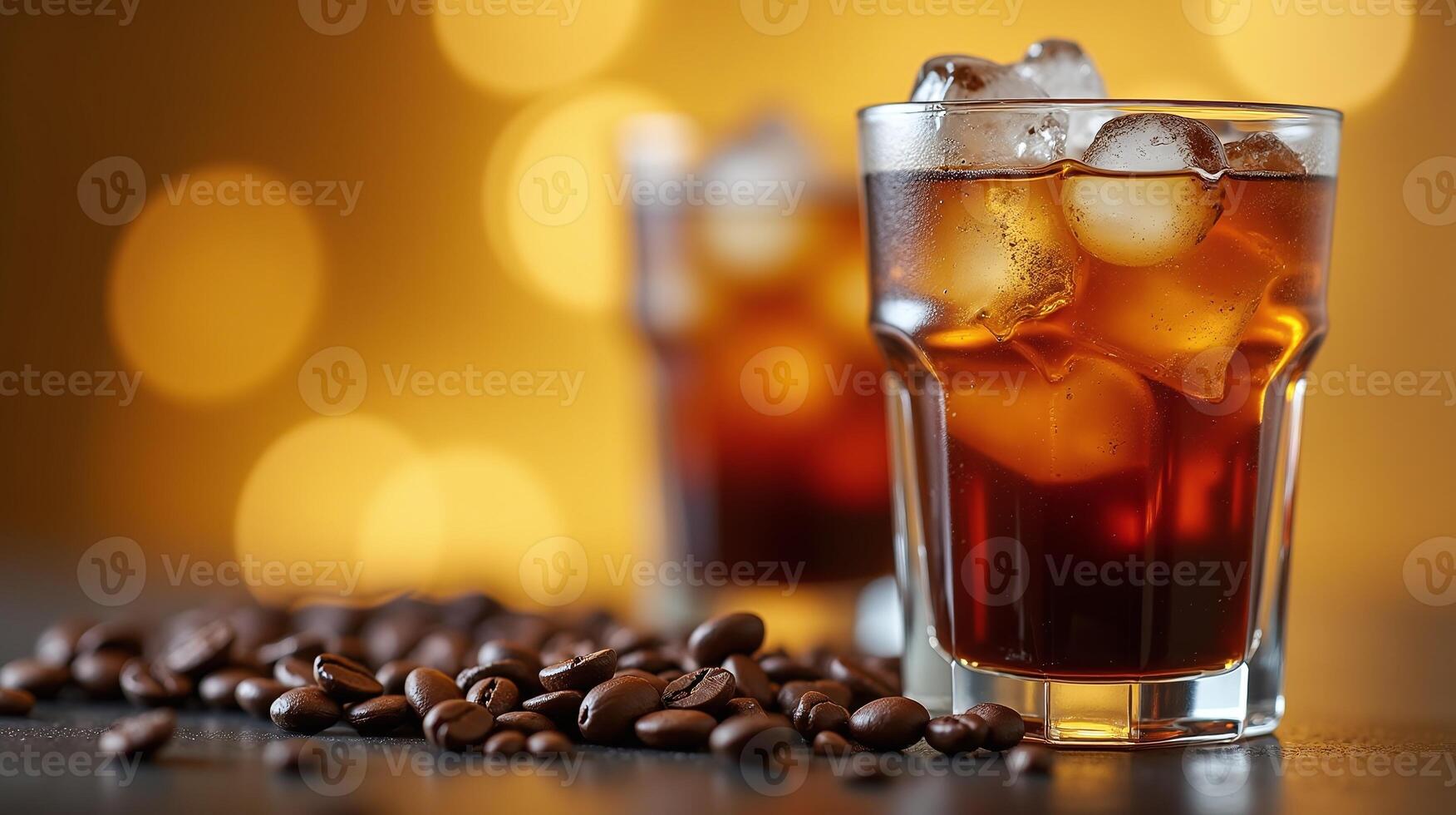 Iced coffee in a glass, surrounded by coffee beans photo