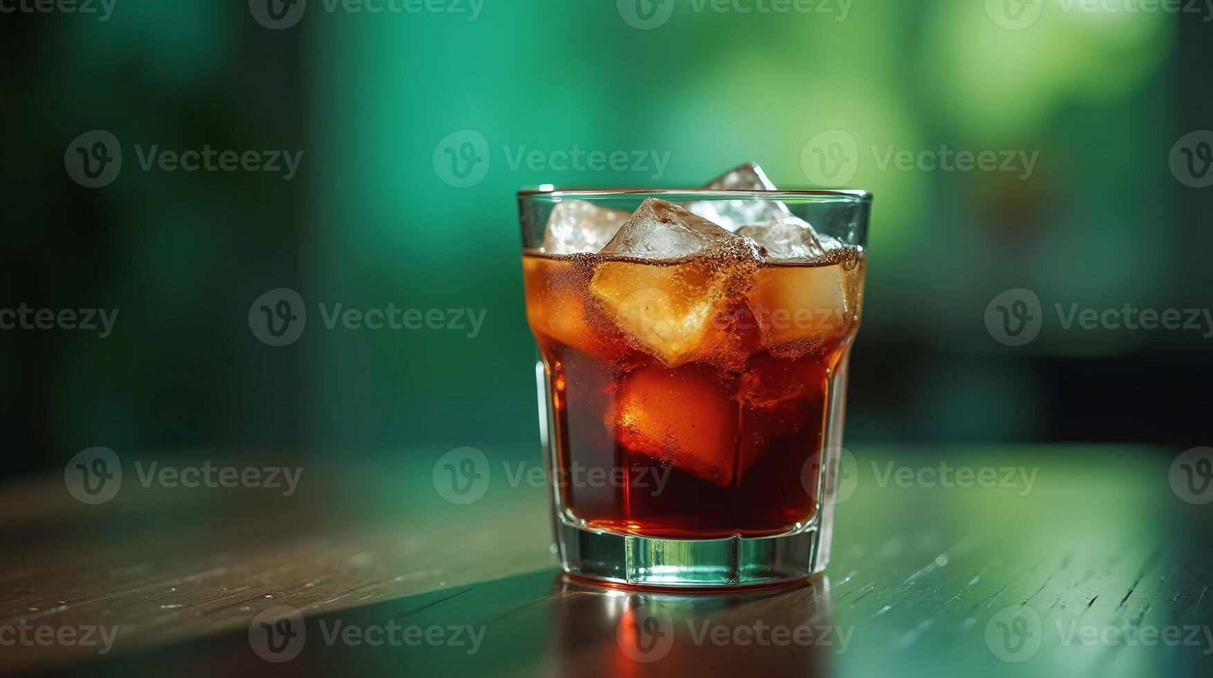 A glass of refreshing water, adorned with ice cubes. photo