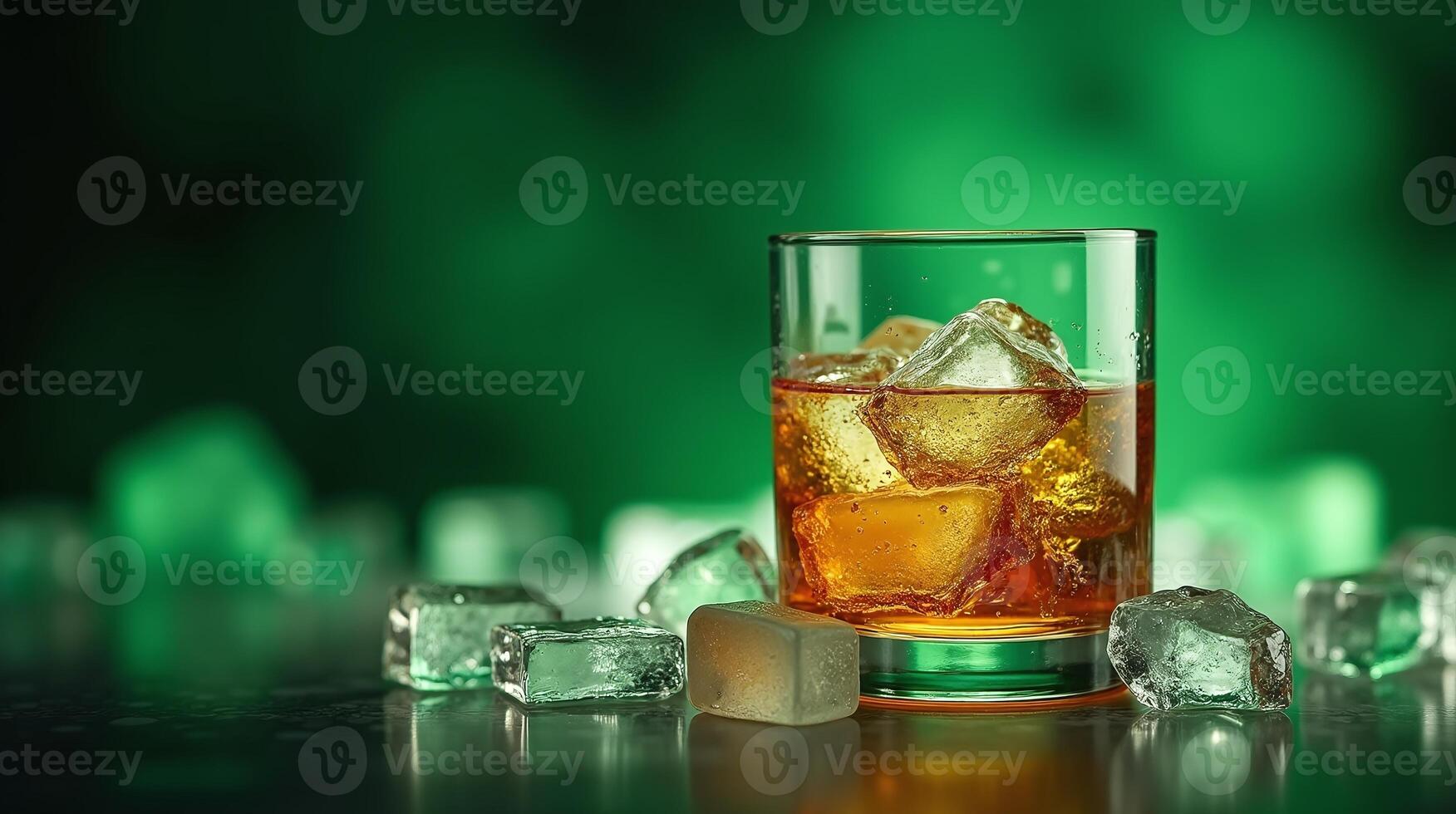 A glass of amber liquid with ice cubes, set against a green bokeh background. photo