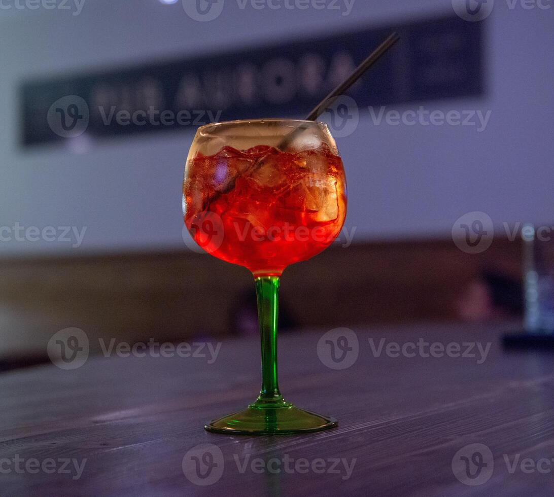 Glass with aperitif placed on the table photo