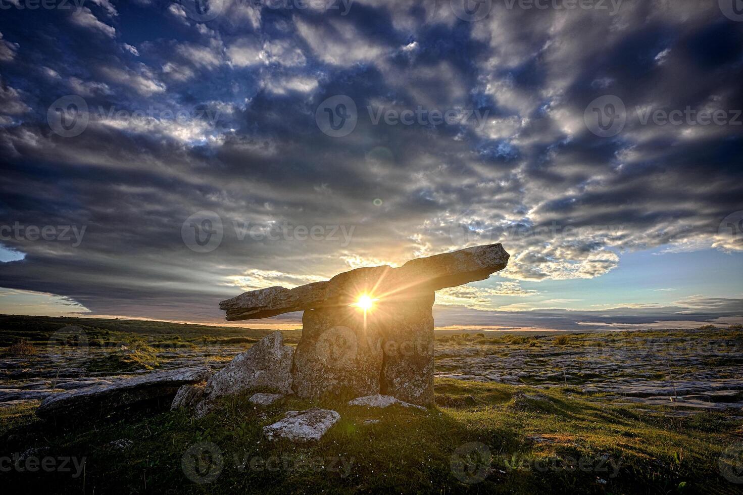 Sunset Poulnabrone dolmen an ancient portal tomb in the Burren, County Clare, in the west of Ireland. photo