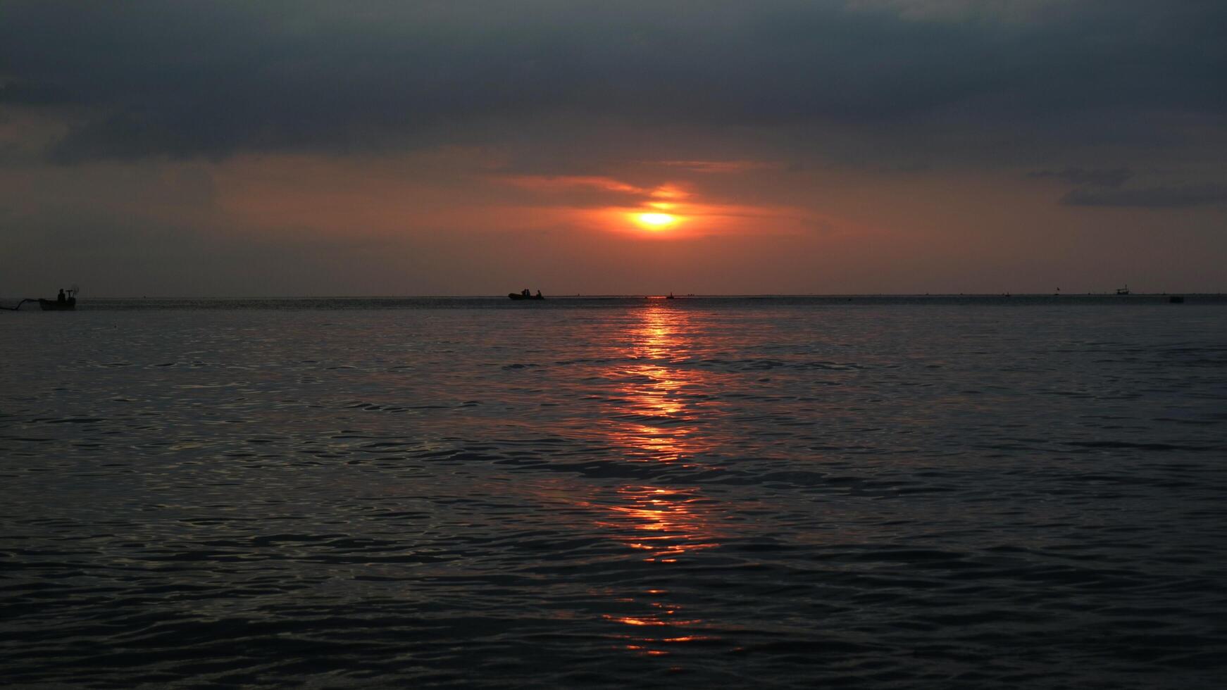 Panoramic sunset view at a luxury beach in the tropics, Serene sunset over calm ocean photo
