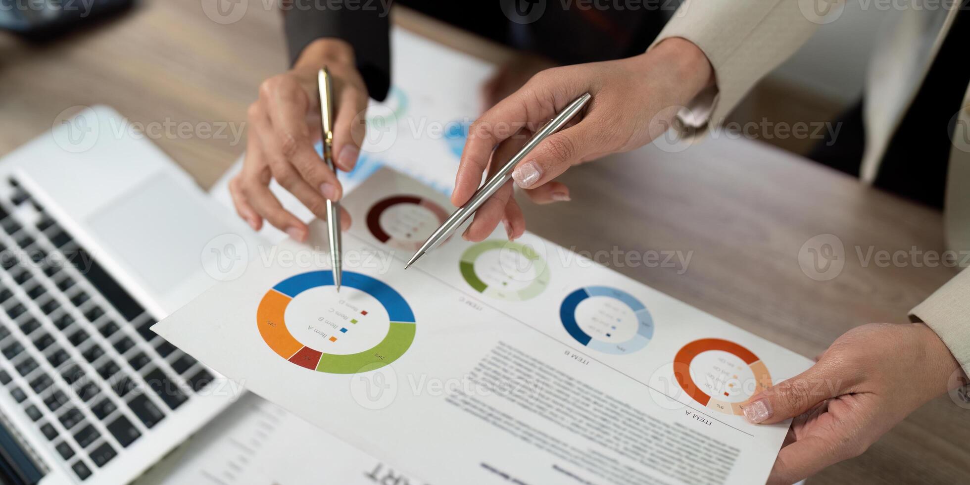 Collaborative Data Analysis. Professionals discussing financial insights with reports. photo