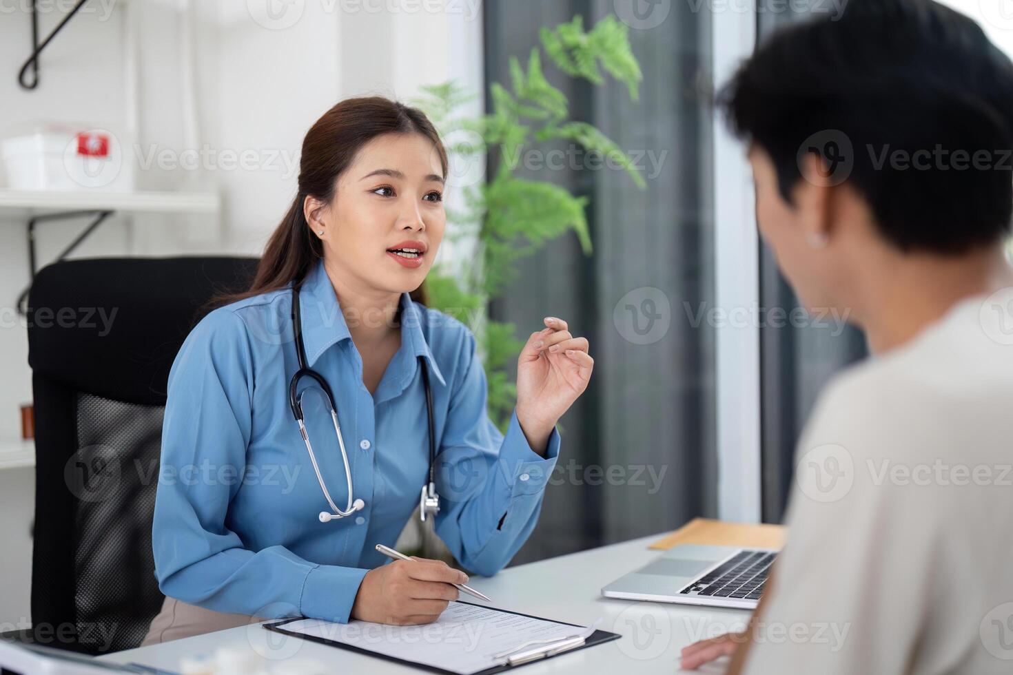 Health and Wellness. Doctor explaining health issues to a patient in a clinical setting. photo