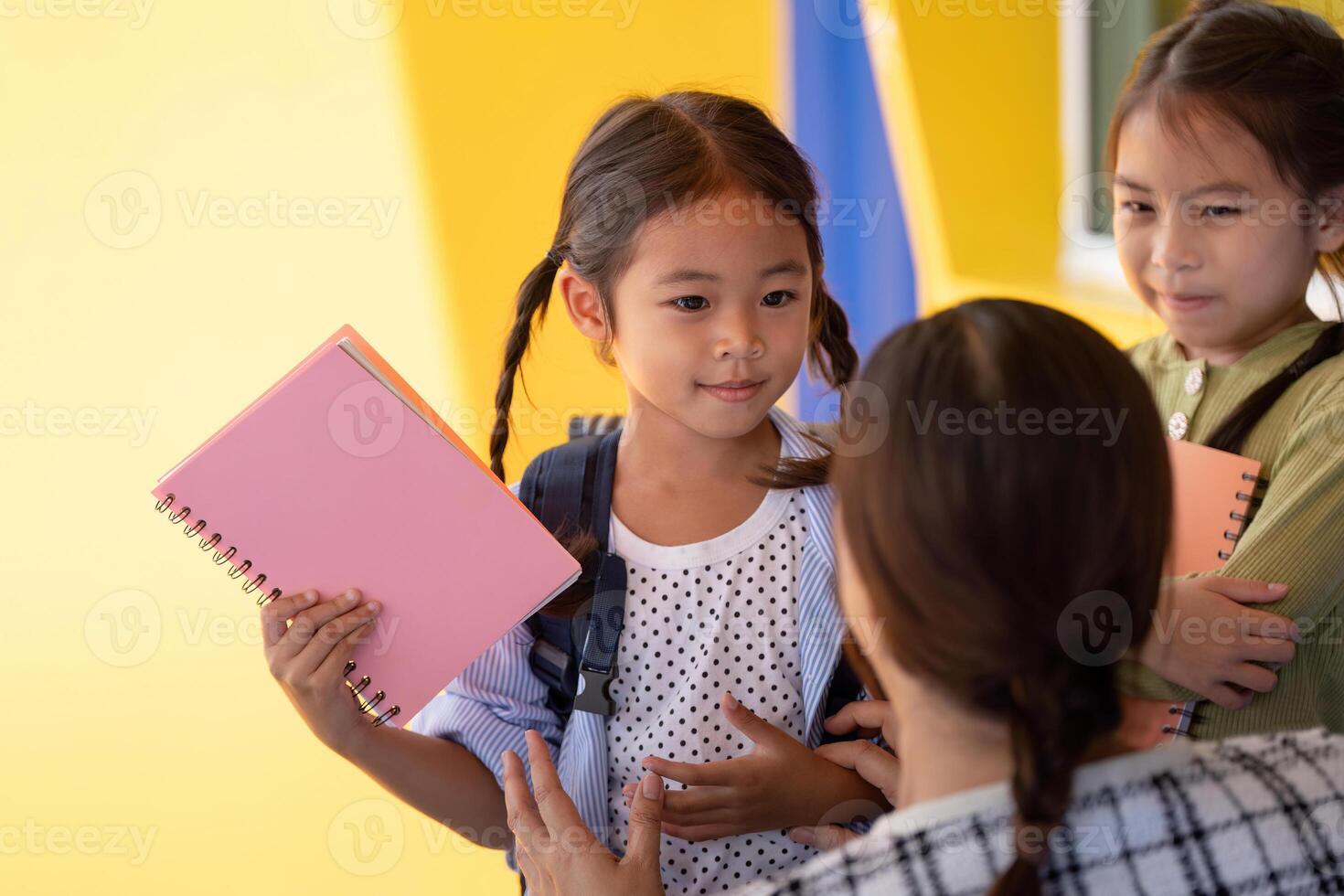 Back to School. Young students excitedly preparing for the new school year with notebooks and backpacks. photo