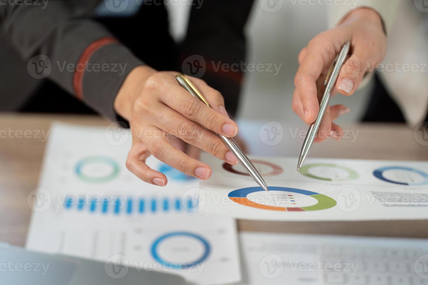 Business Professionals Analyzing Data Charts and Reports in Office Setting. photo