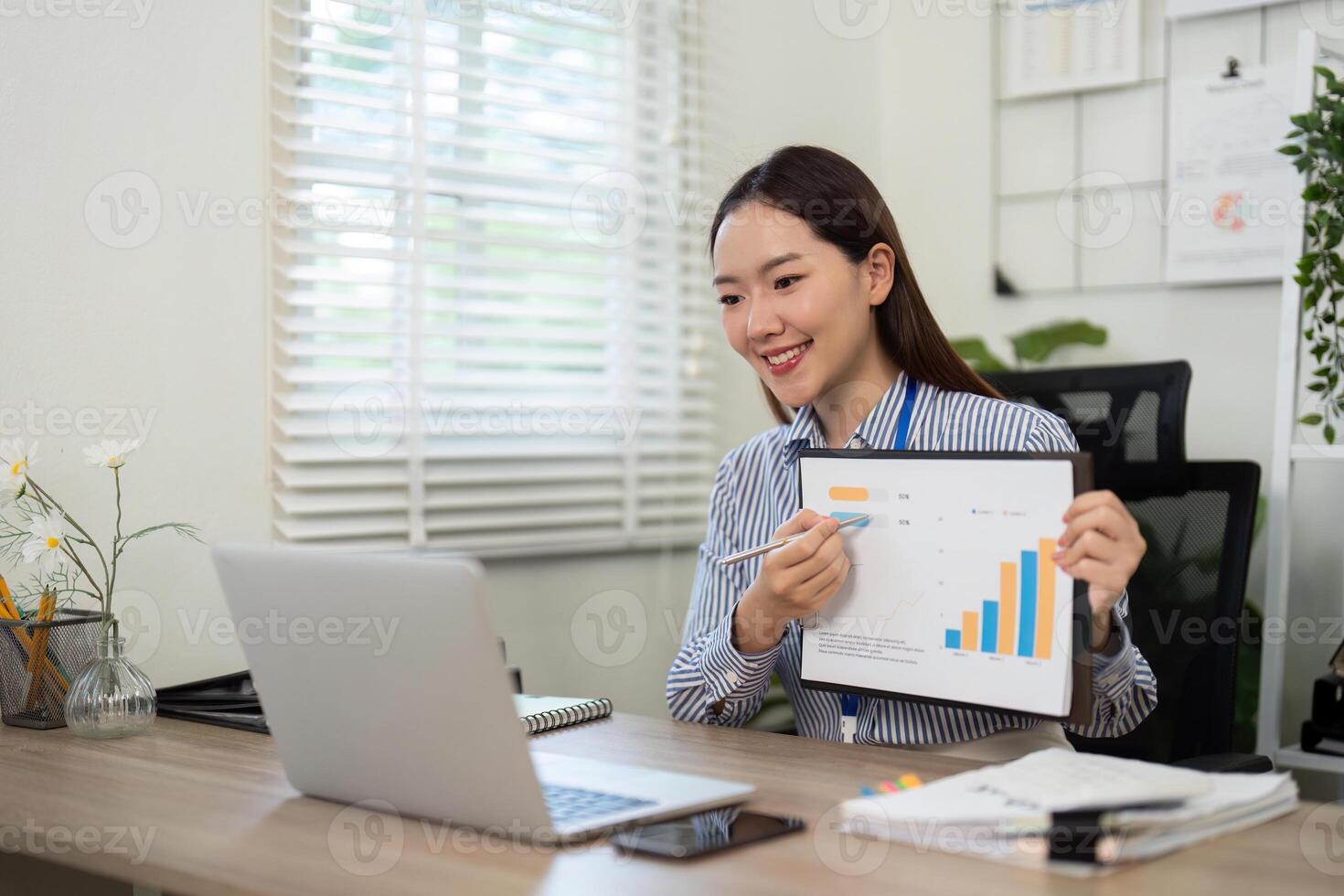 Data Presentation. Businesswoman showing graph in call. photo