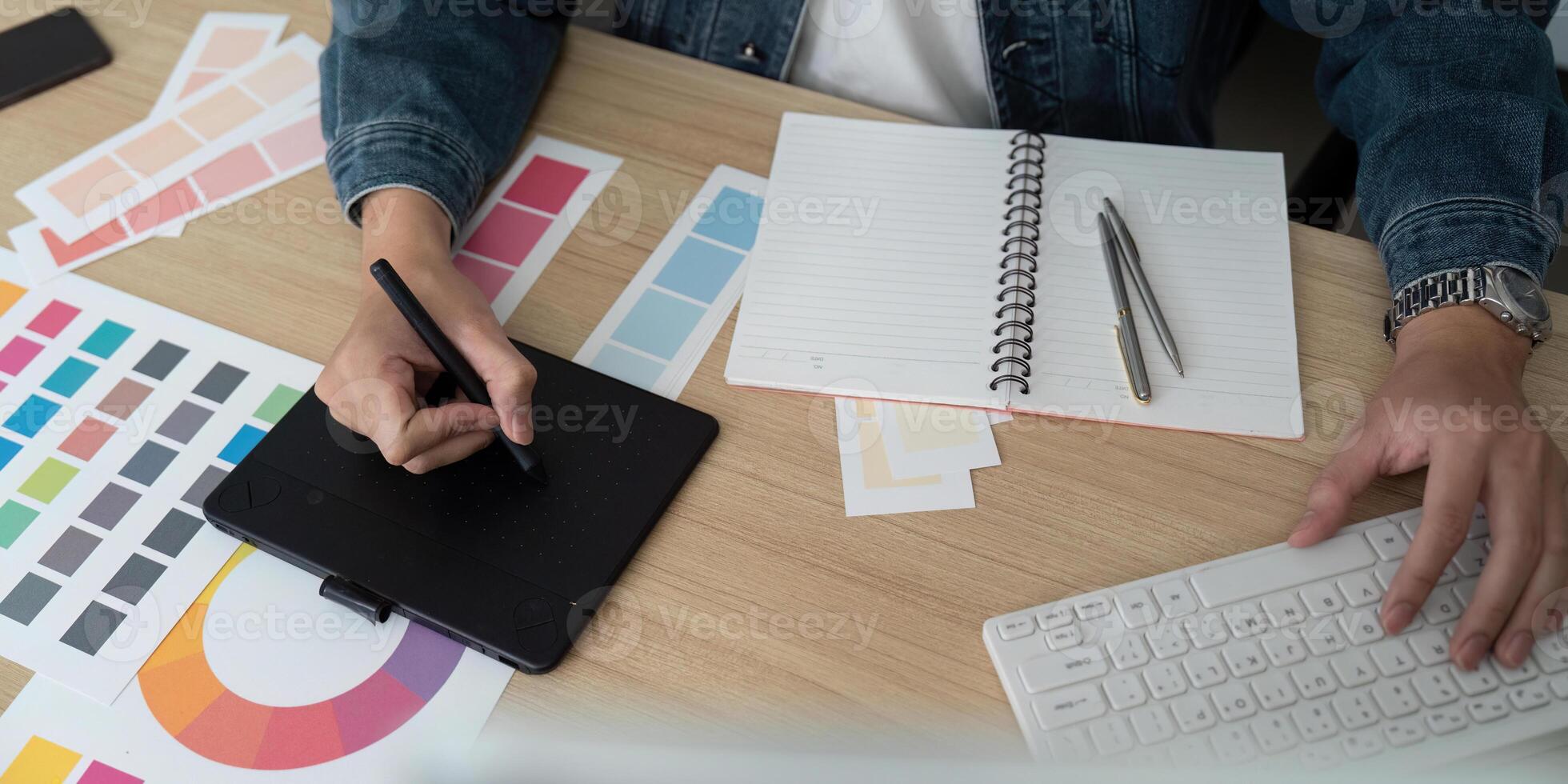 Design Process. Creative Professional Working with Color Palettes photo