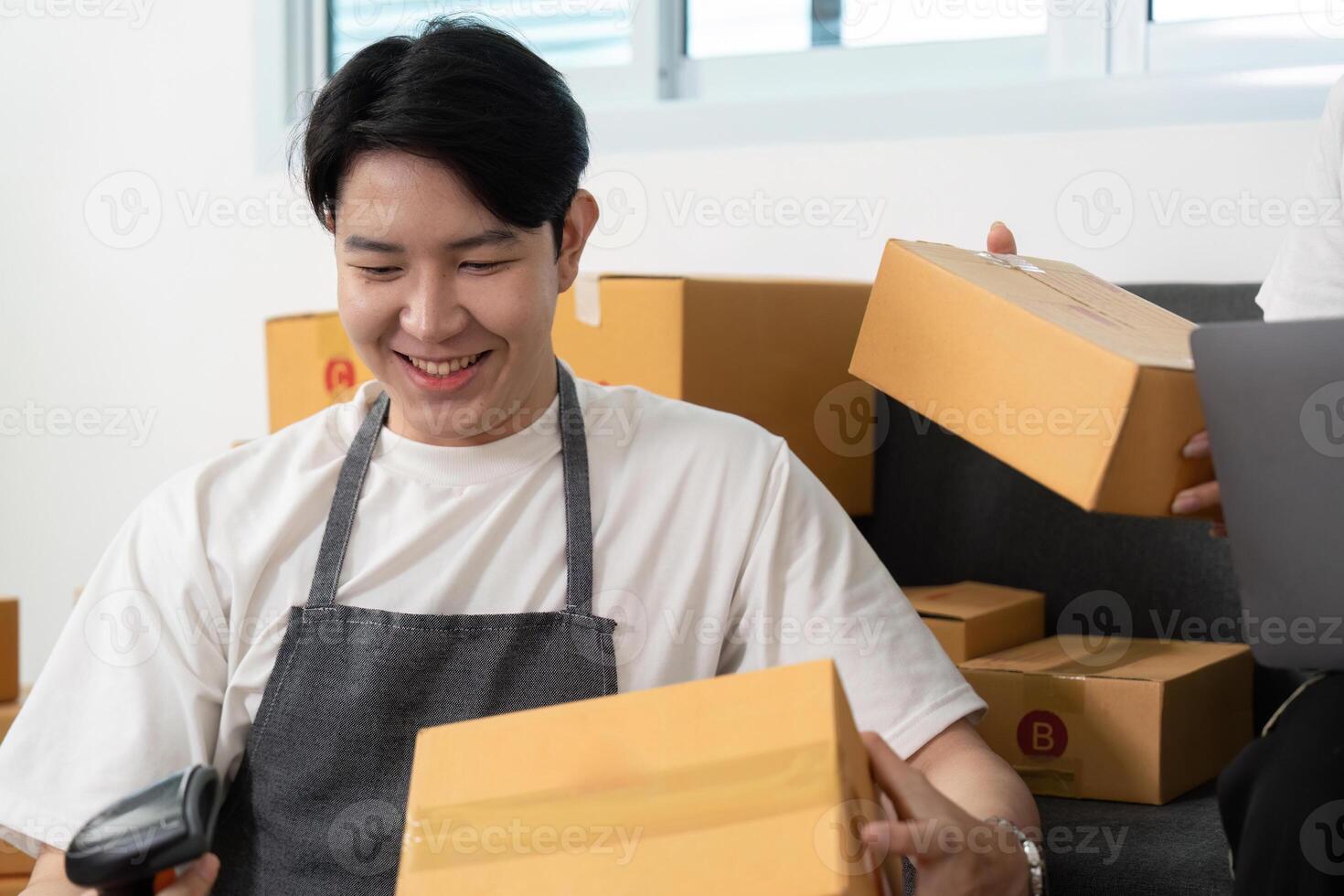 Couple managing inventory together in a friendly work environment. photo