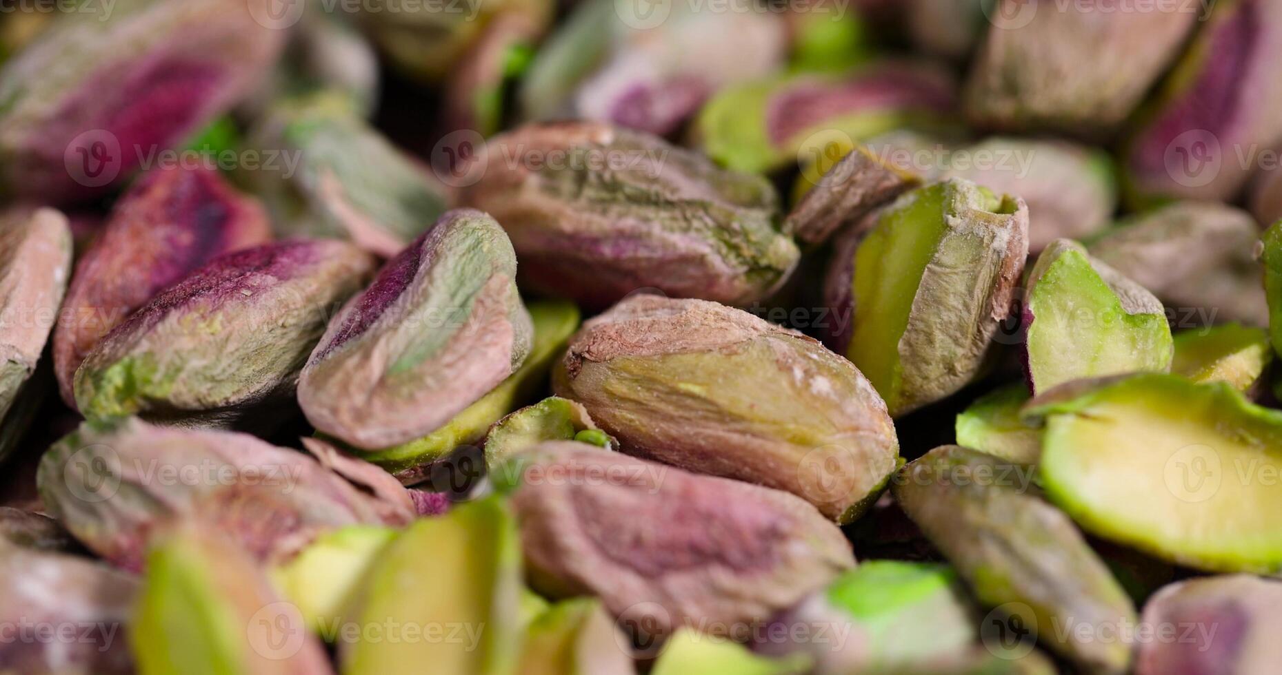 fried green pistachios peeled from the shell, salted crunchy nuts photo