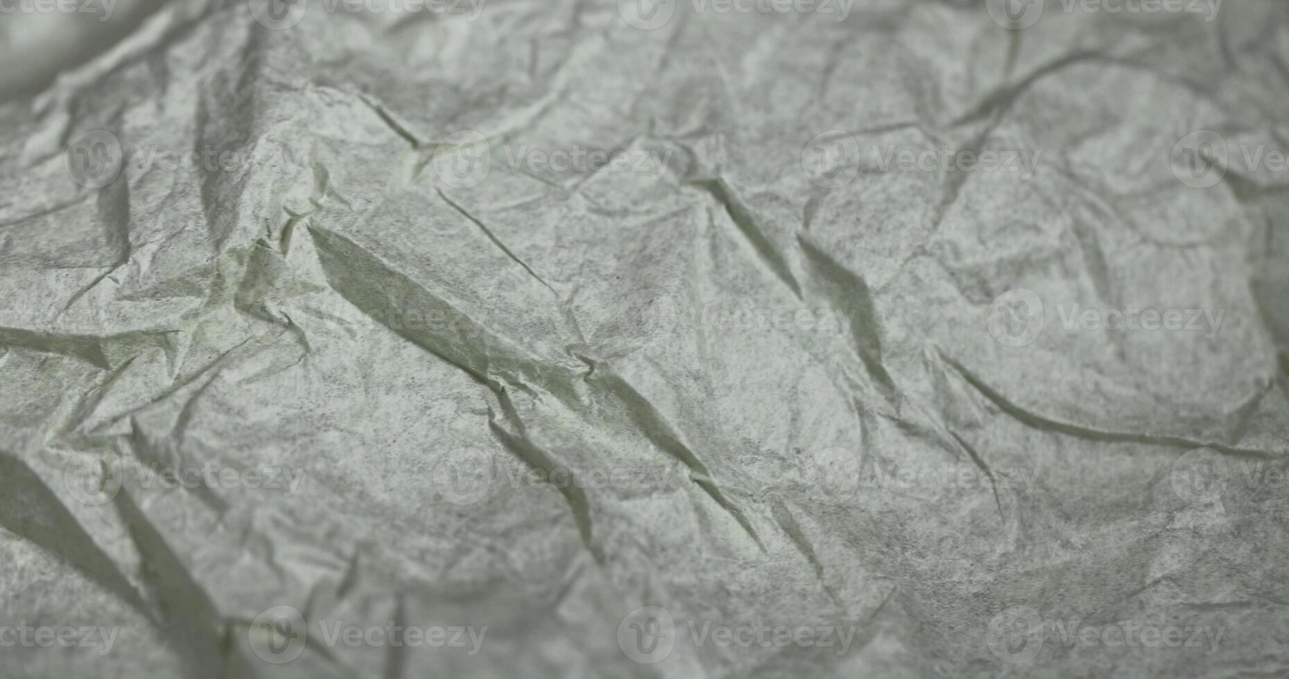 crumpled paper for packaging or other purposes, a sheet of paper crumpled after use photo