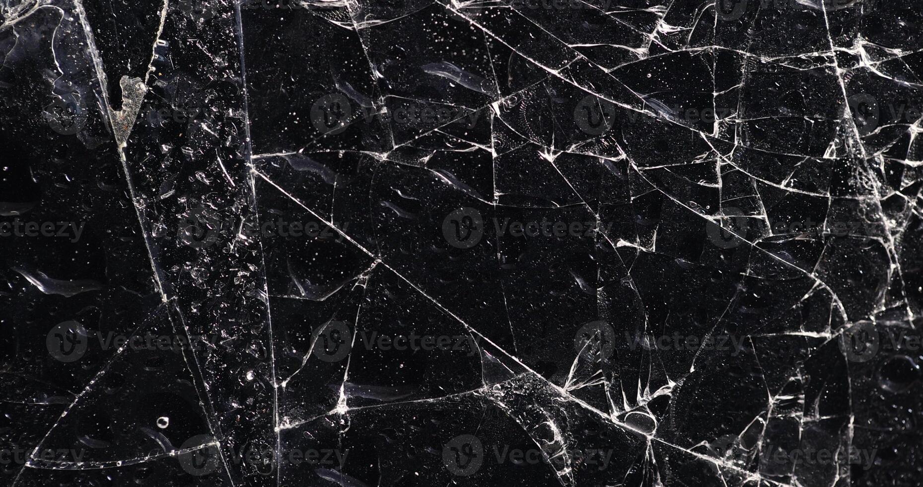wet thin glass broken into many pieces photo