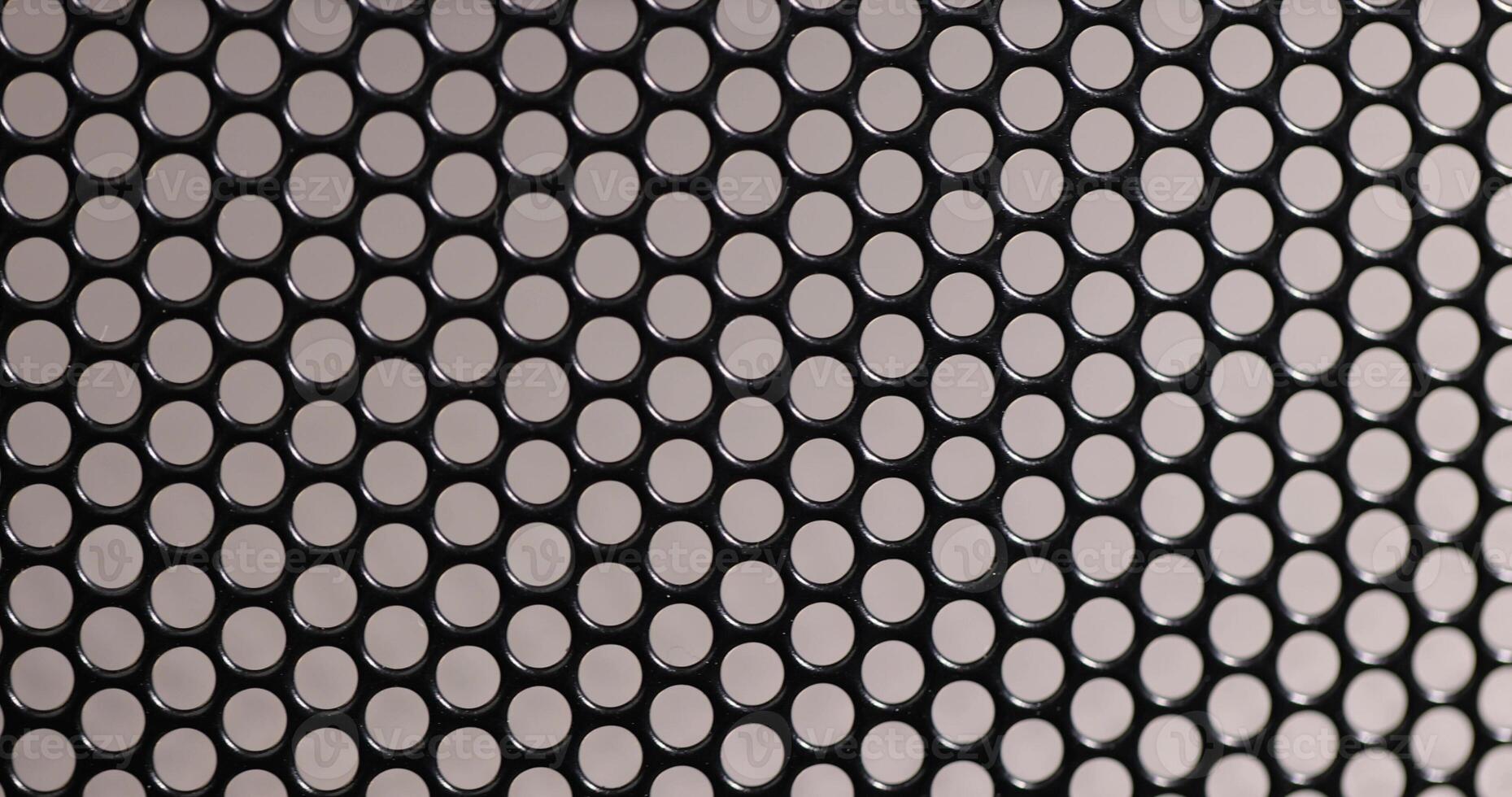 a mesh to protect electrical appliances from debris and other objects that can damage the appliance, a metal mesh with small holes photo