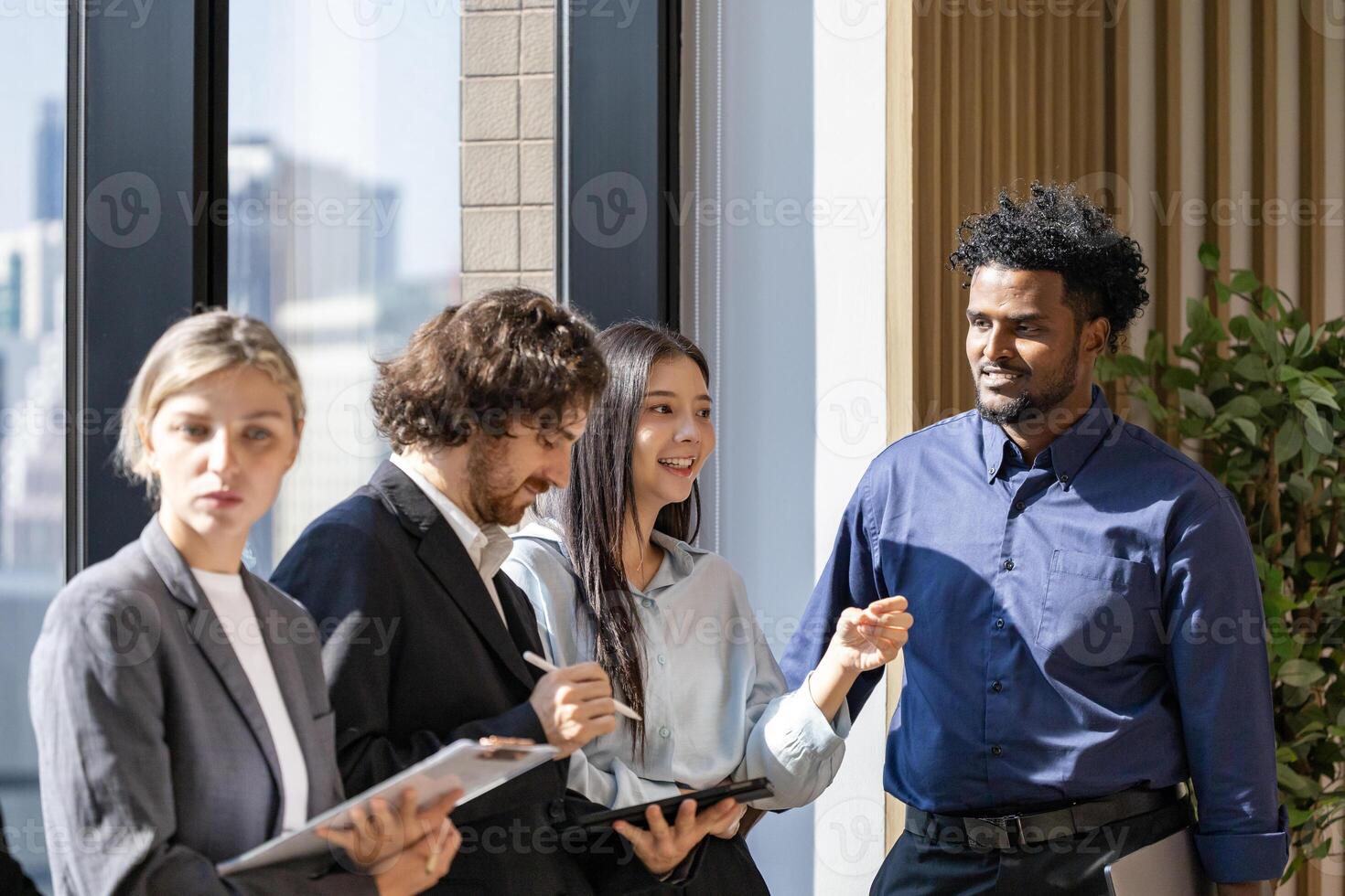 Team of diversity business people are discussing over new strategic strategy project on investment real estate while brainstorming around the office building for new project and planning photo