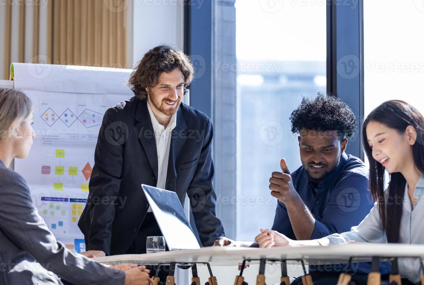 Diversity business team people are discussing over the new strategic strategy project on investment real estate while working in modern office building for new project and planning photo