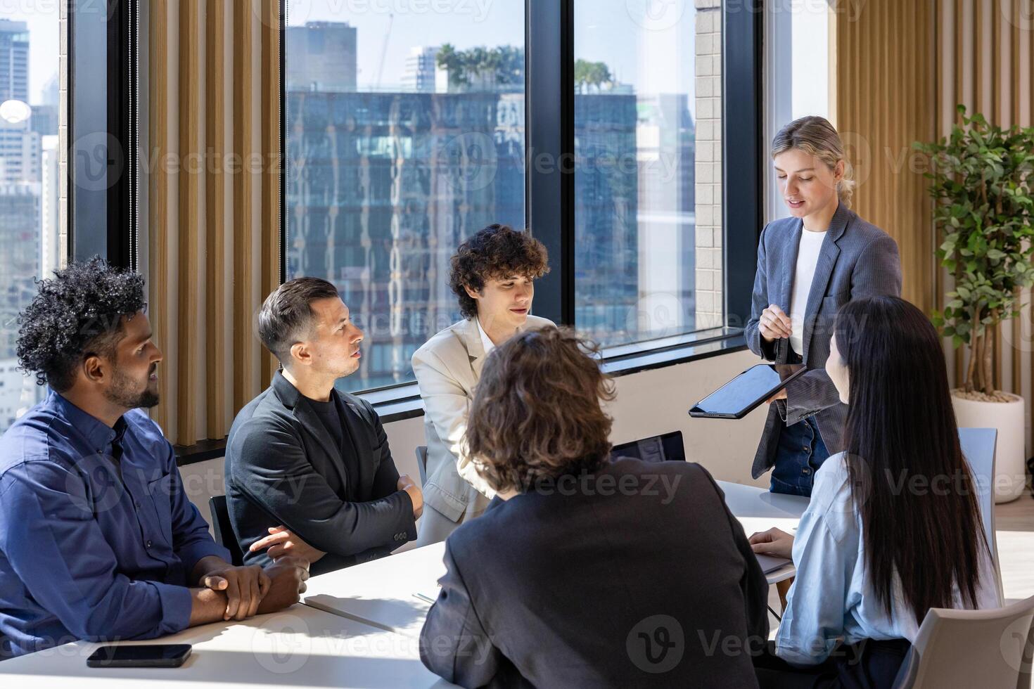 Caucasian woman sale manager is showing annual report chart to colleagues in executive meeting for next year plan with market share increase for global business and investment photo
