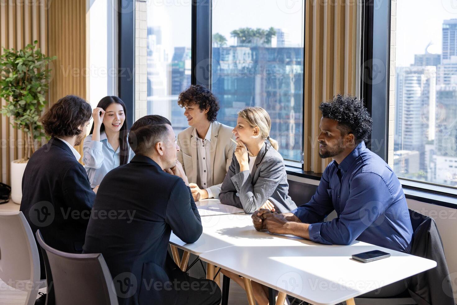 Team of diversity business people are discussing over new strategic strategy project on investment real estate while working inside modern office building for new project and planning photo