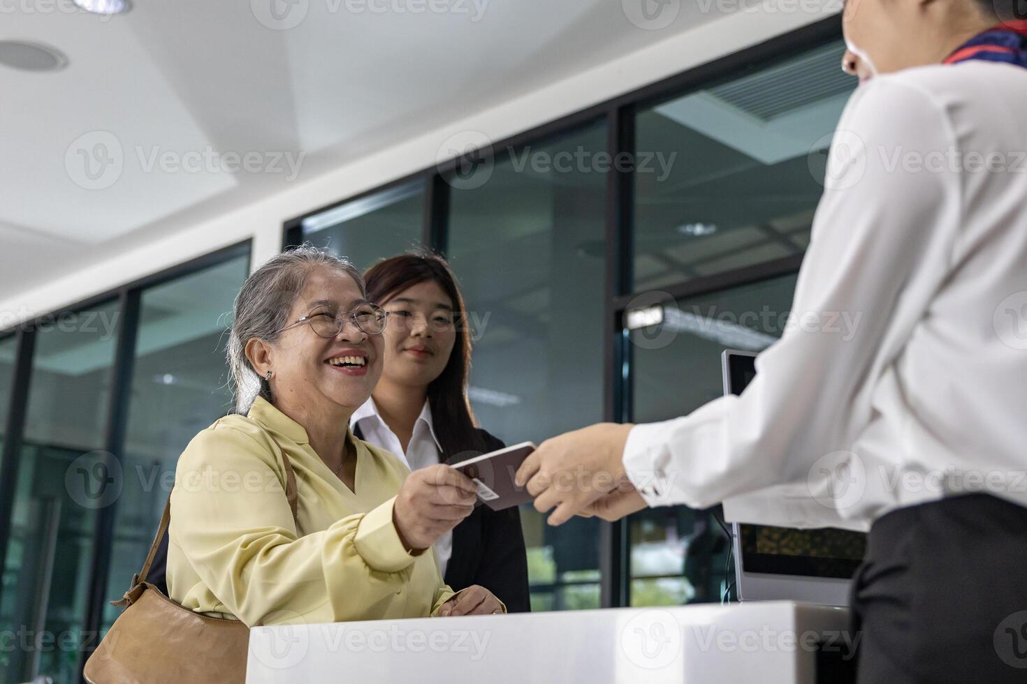 Airline ground staff using metal scanner for security check every passenger in the airport departure terminal for safety protocol before boarding into plane photo