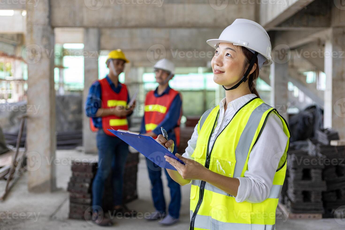 Team of asian engineer in full safety gear is inspecting inside the building structure for investigation over specification on construction site industry and quality control photo
