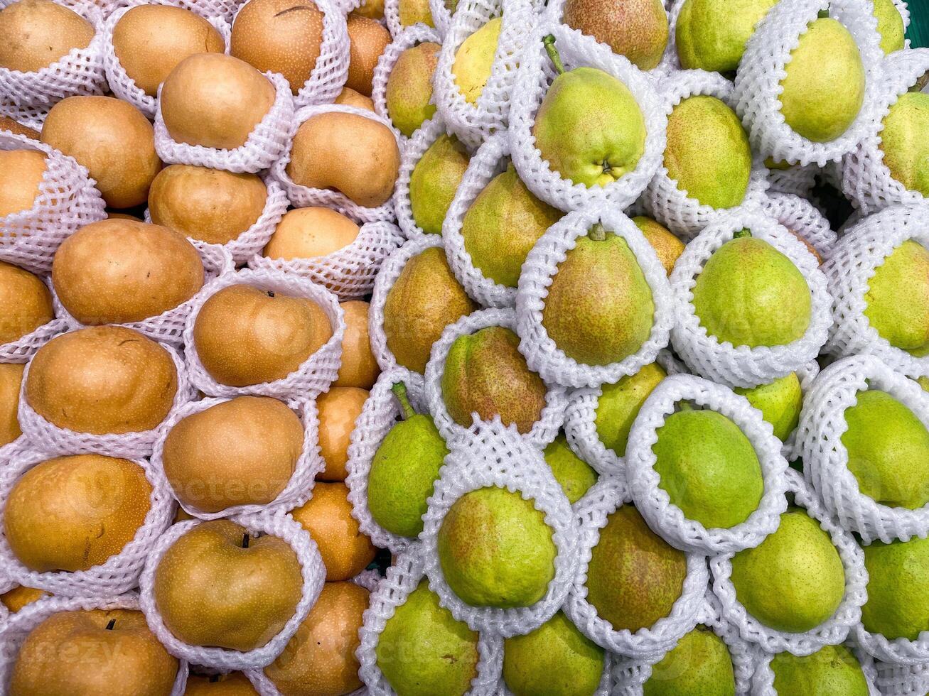 Fragrant Pears, Snow pears in wooden basket for selling in supermarket photo