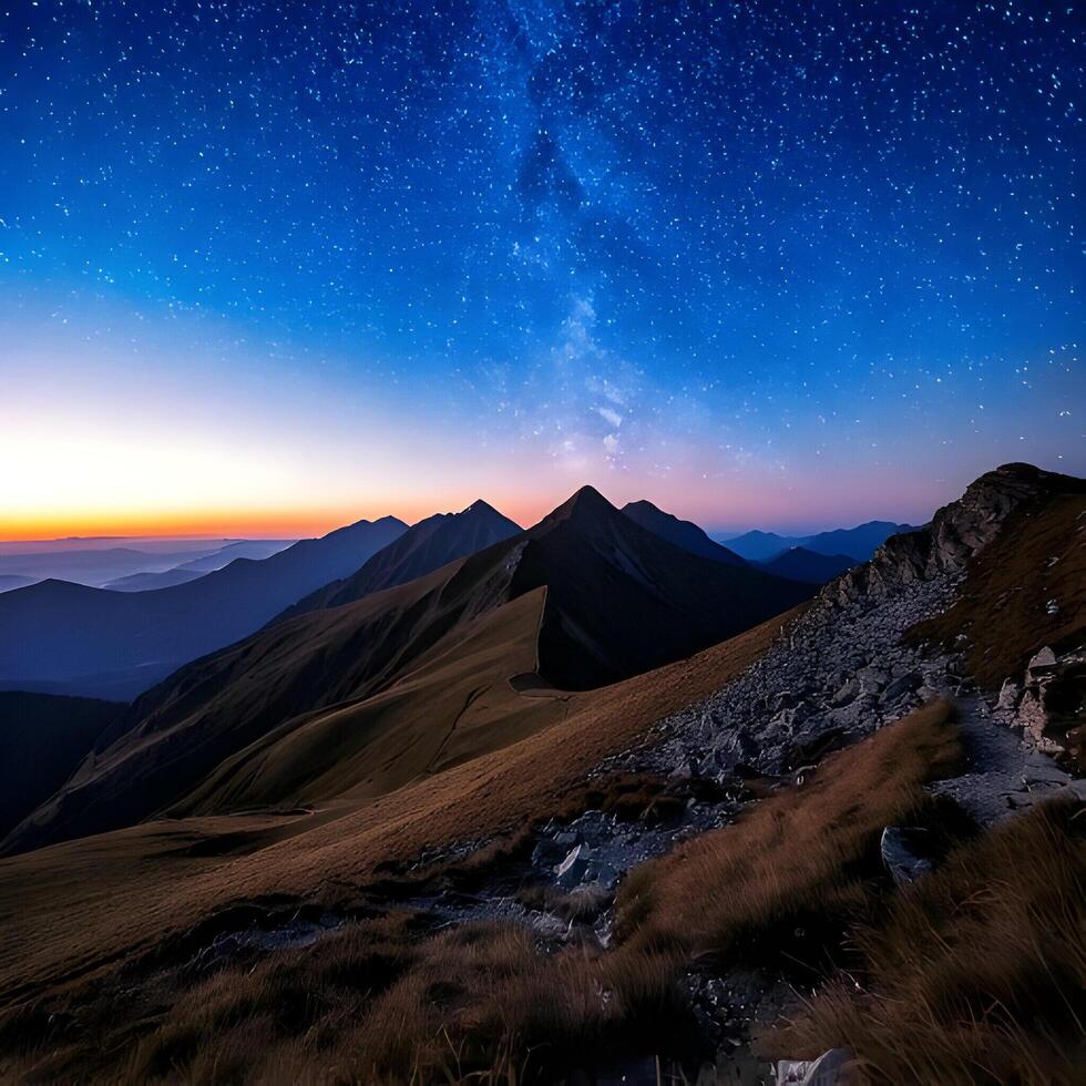 Majestic Mountain Range Under a Starry Night Sky photo