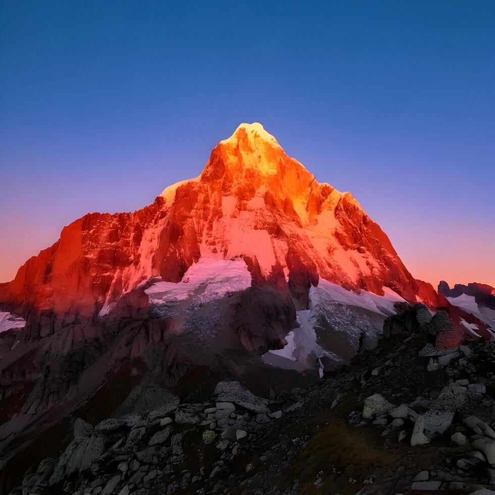 Majestic Mountain Peak at Sunset with Snow and Rocks photo