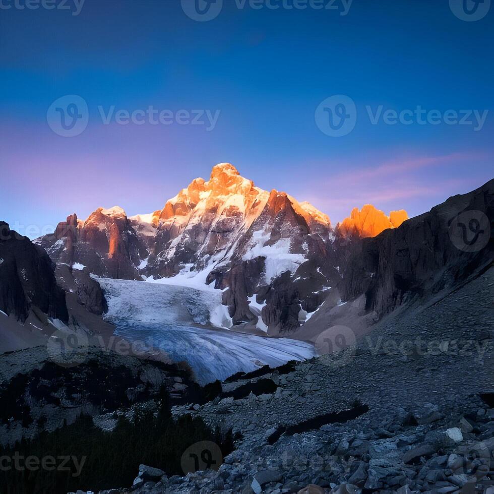 Majestic Snow-Capped Mountain Peak at Sunset photo