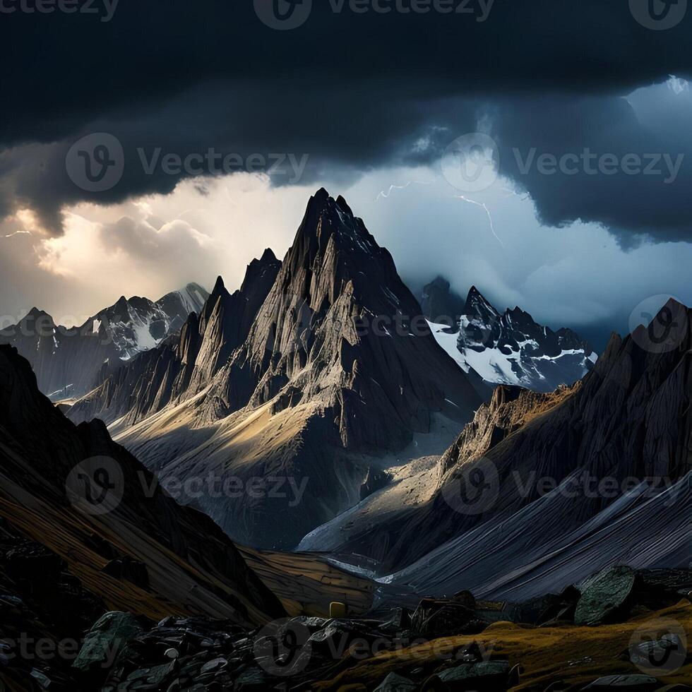 Dramatic Mountain Peak in a Dark Cloudy Sky photo